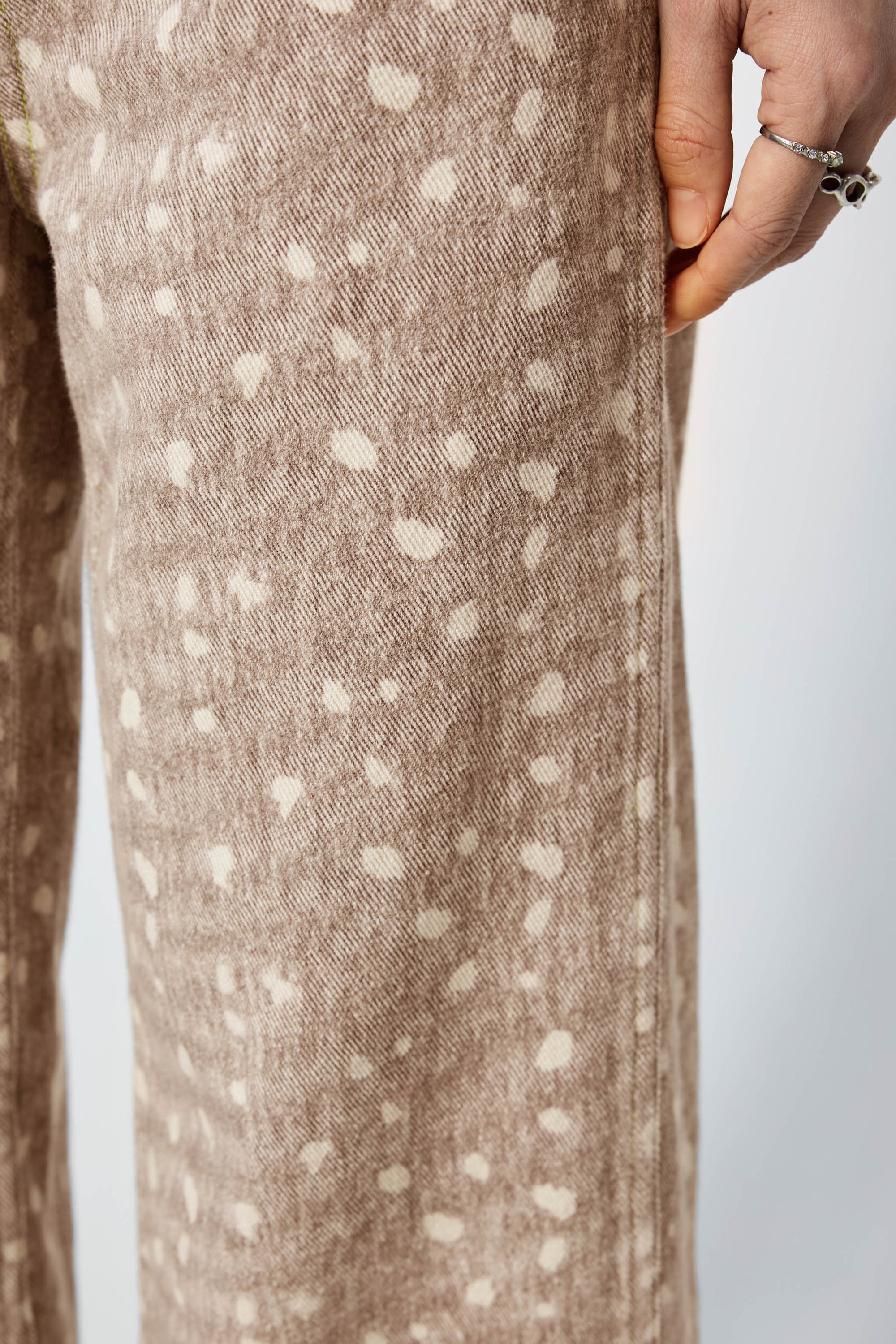 Arthur Apparel light brown straight leg jeans with white spots