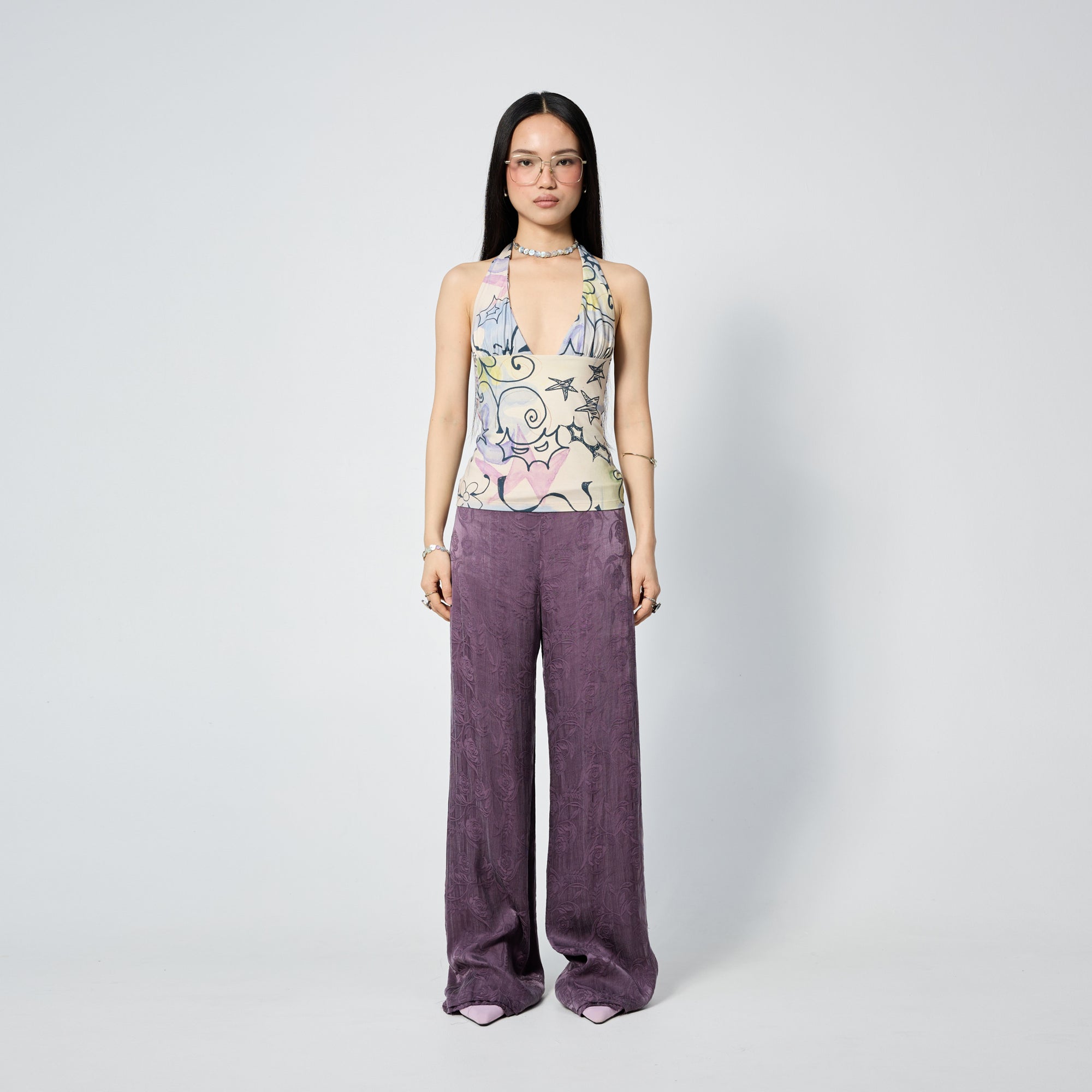Arthur Apparel purple straight leg pant with frayed hem and roses print