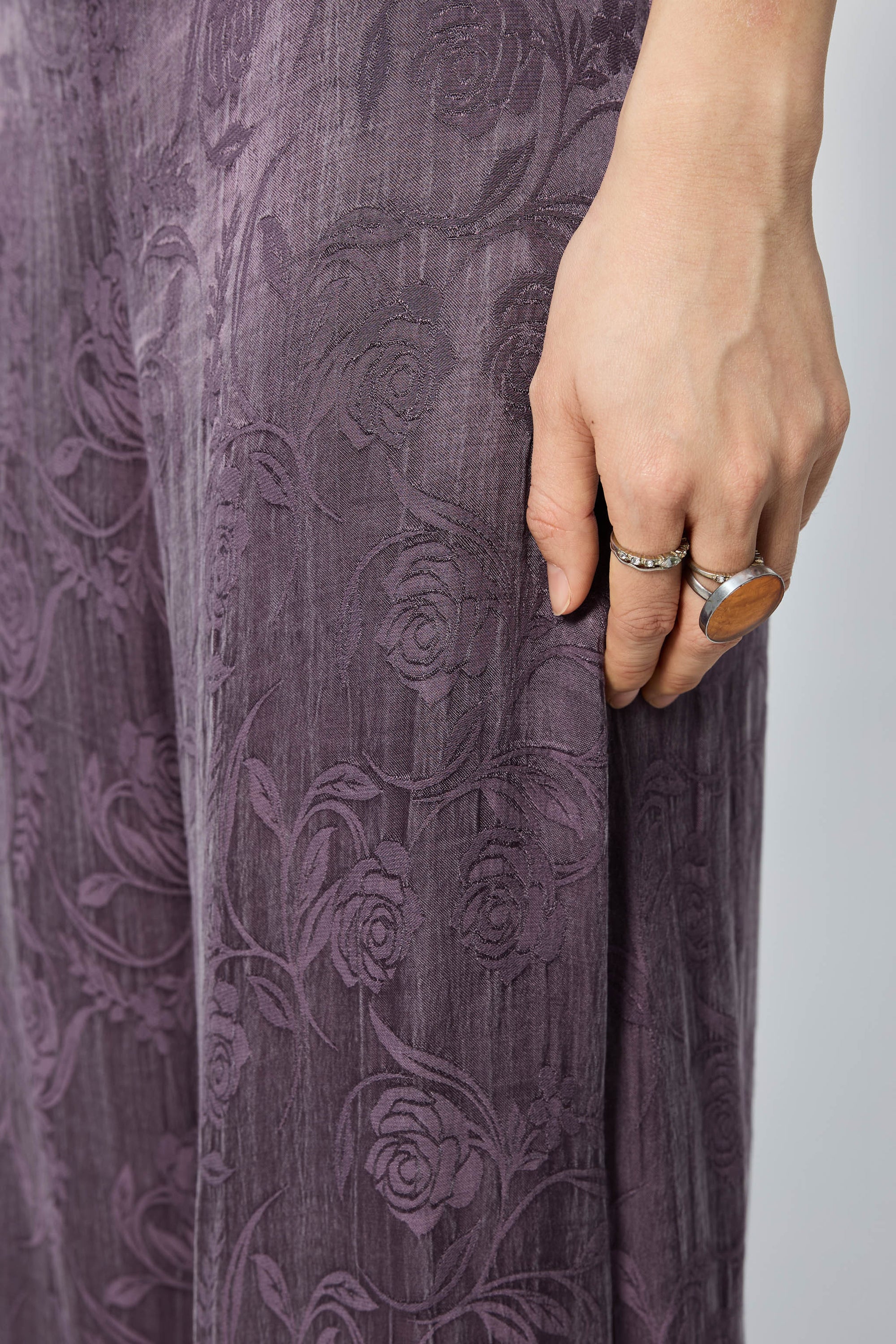 Arthur Apparel purple straight leg pant with frayed hem and roses print