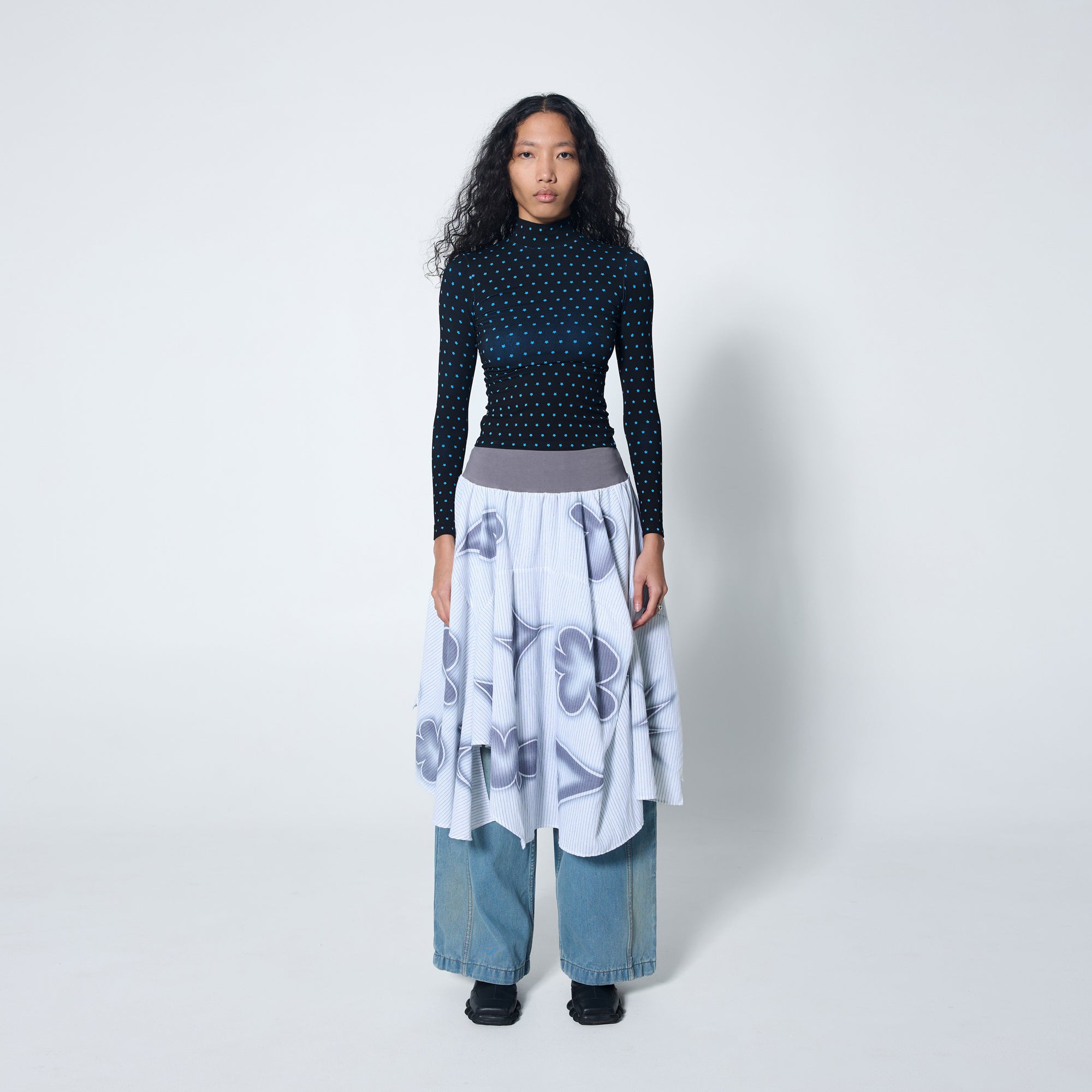 Arthur Apparel two-tone bamboo turtle neck with black and blue star print